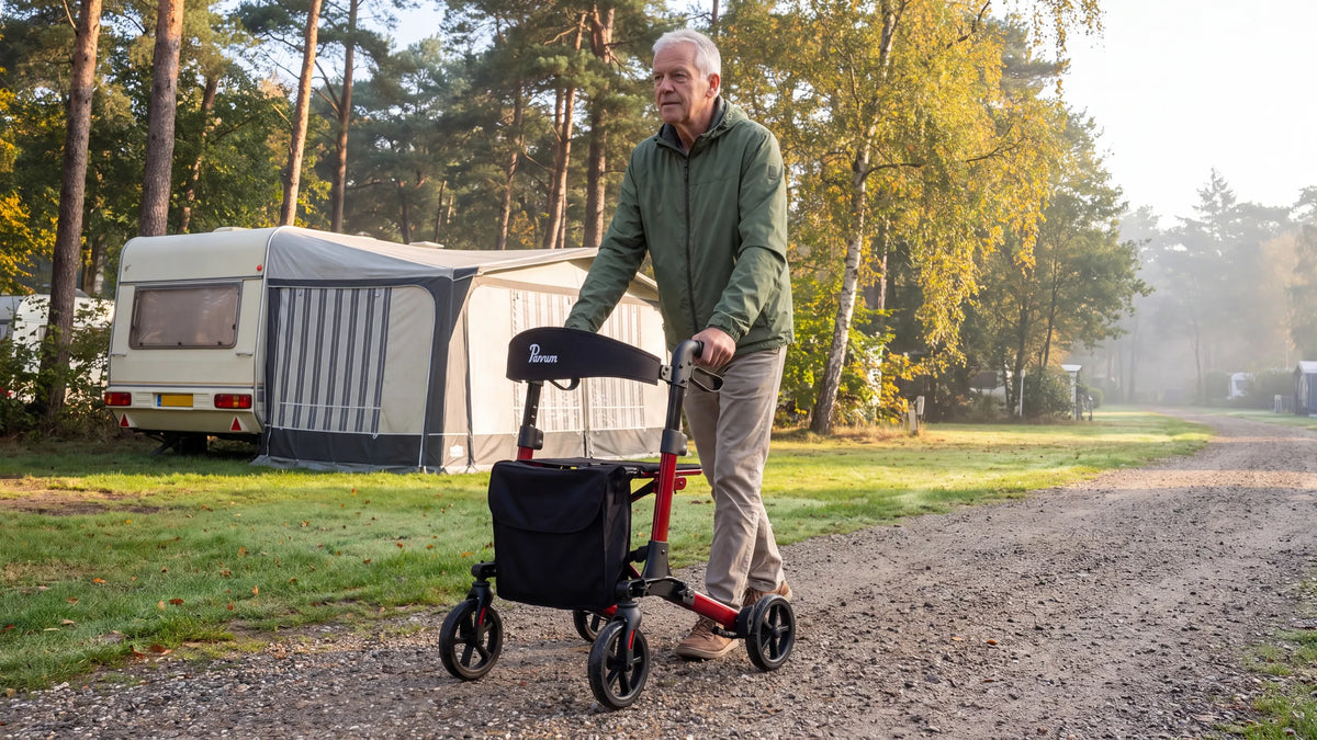 Parvum Brava in ruby red at a campsite in the morning mist; a man walks with the rollator past the caravan.